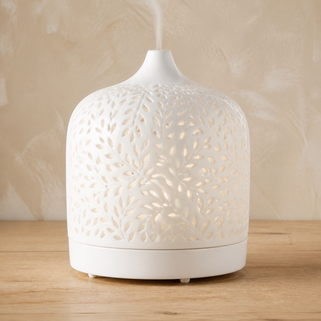 AI-generated representation of a broad white ceramic diffuser with a pierced leaf pattern resembling the Earnest Living 500ml model